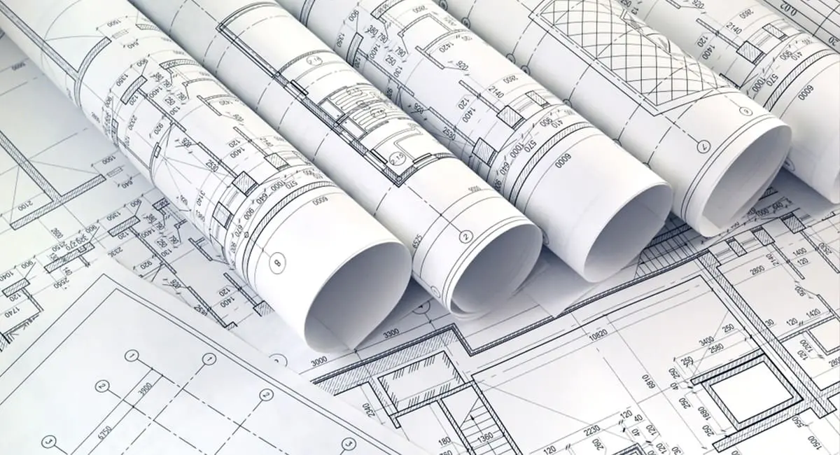 Architectual lab design Rolled architectural drawings on a desk