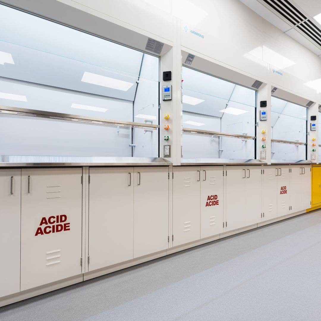 Fume hood with safety signage in a teaching laboratory